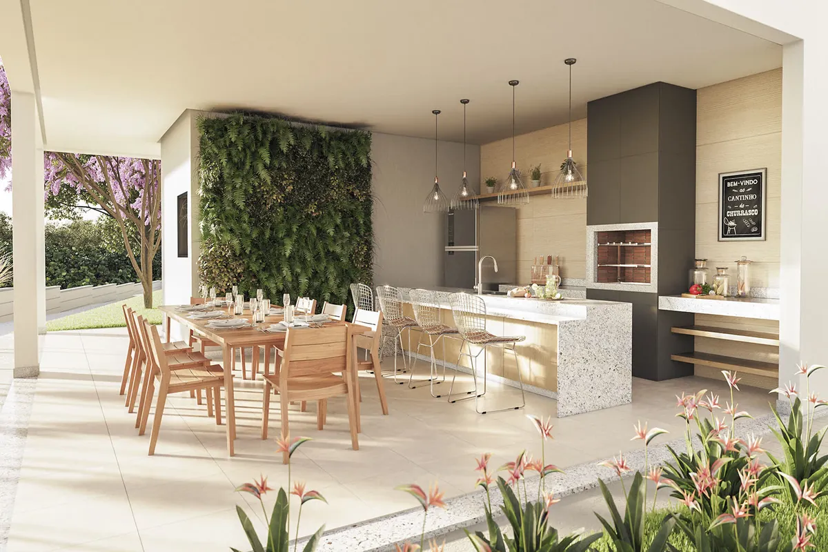 Espaço gourmet do condomínio com churrasqueira, mesa longa e jardim vertical